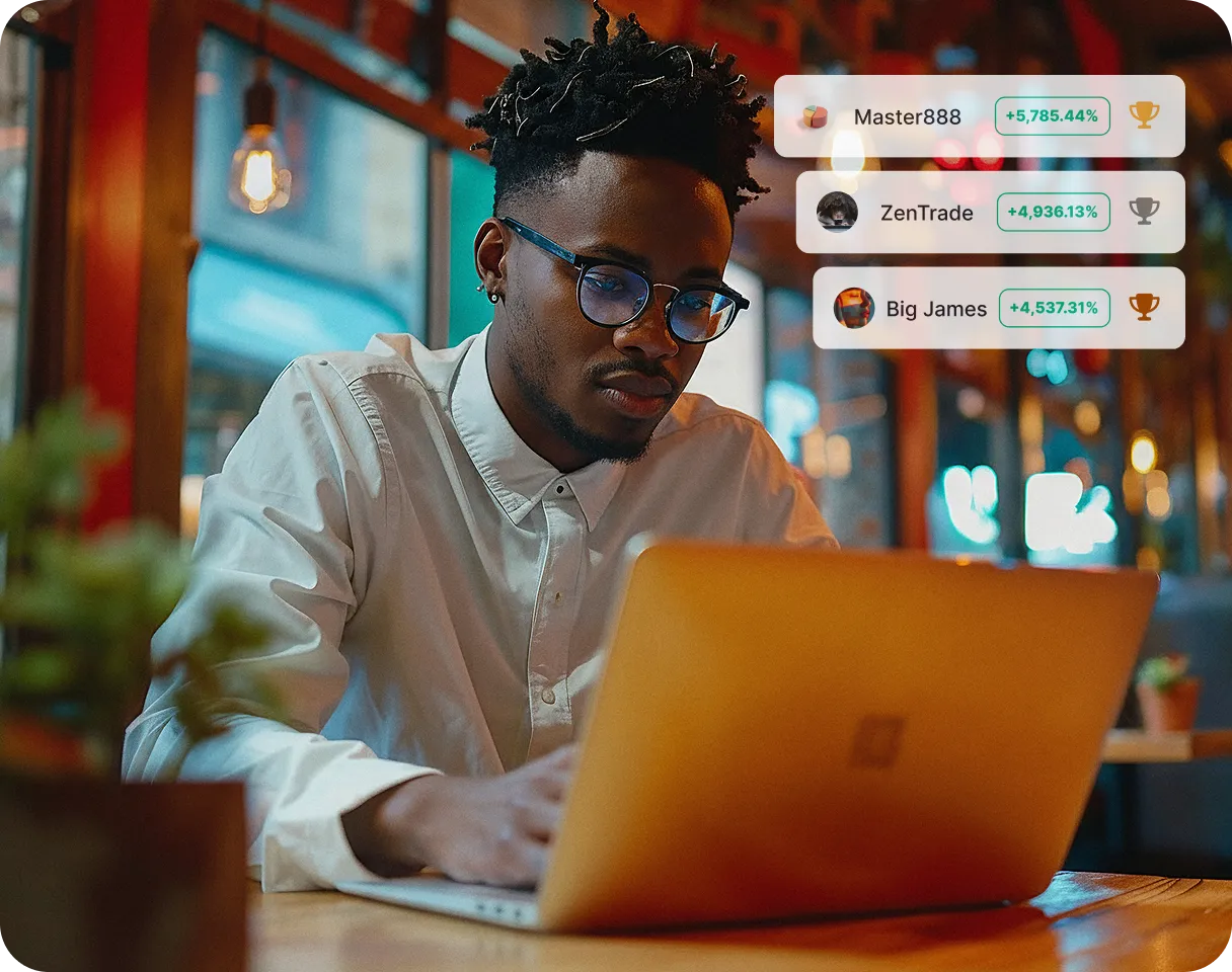 Man using a laptop in a café with a leaderboard overlay showing top traders and their high returns in a trading competition.