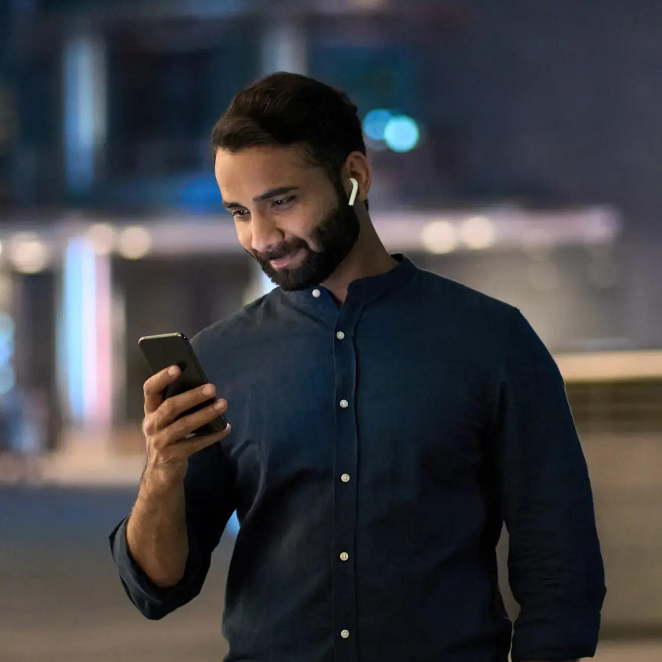A male trader checking Deriv's Ethereum trading platform on mobile device