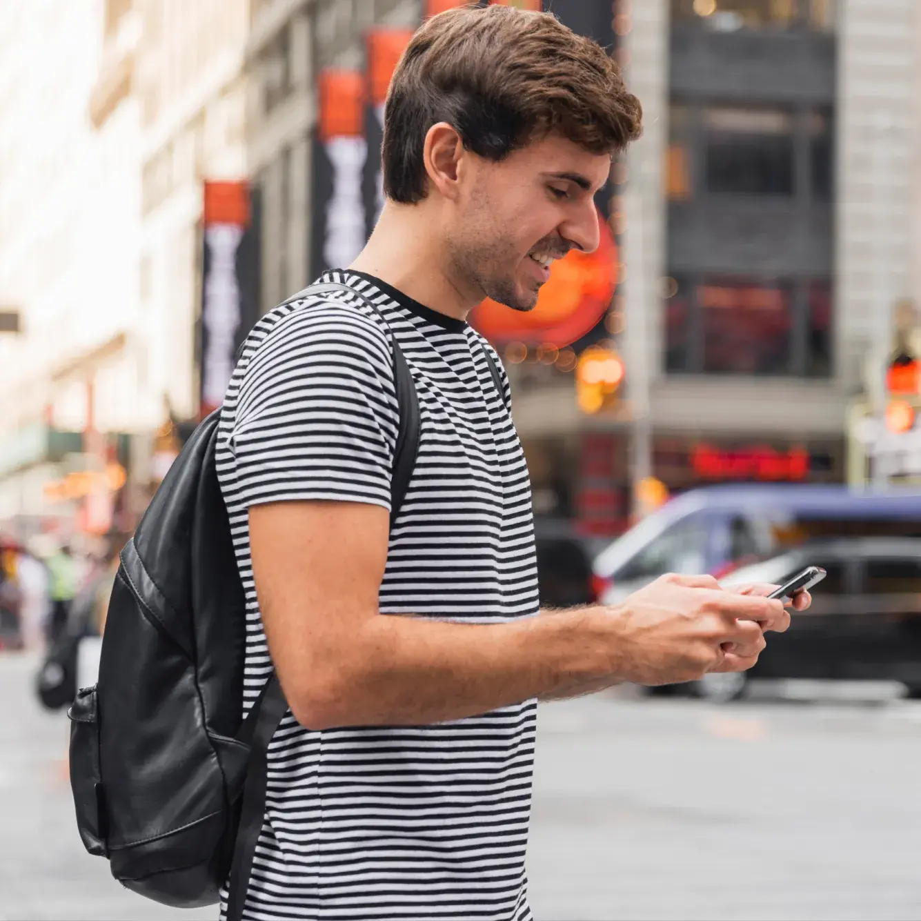 Trader using a mobile phone to place a US SP 500 trade on Deriv